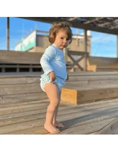 Ensemble anti-UV gilet et maillot de bain bébé.